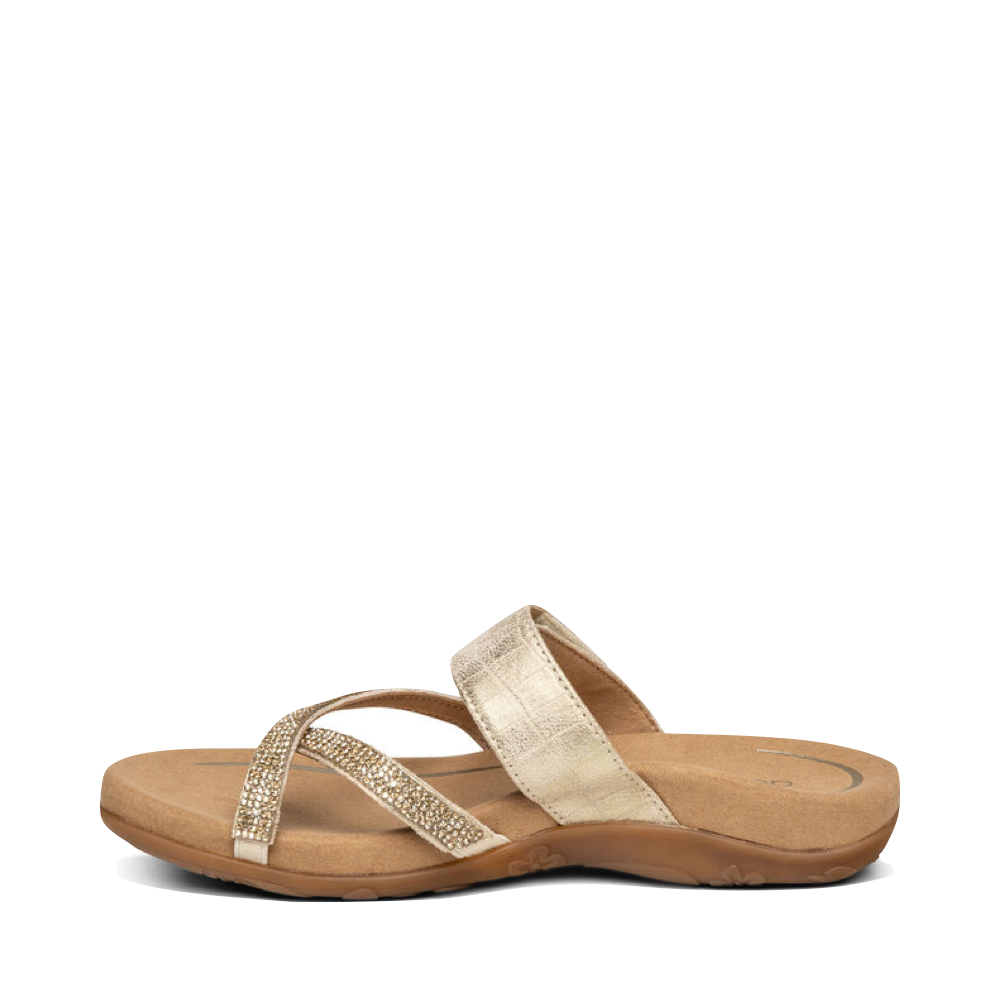 Side (left) view of Aetrex Izzy Adjustable Slide Sandal for women.