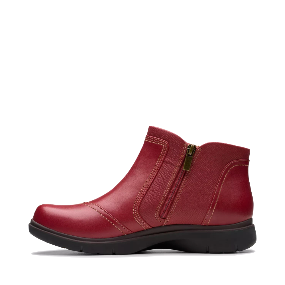 Side (left) view of Clarks Certina Joy Leather Side Zip Ankle Boot for women.