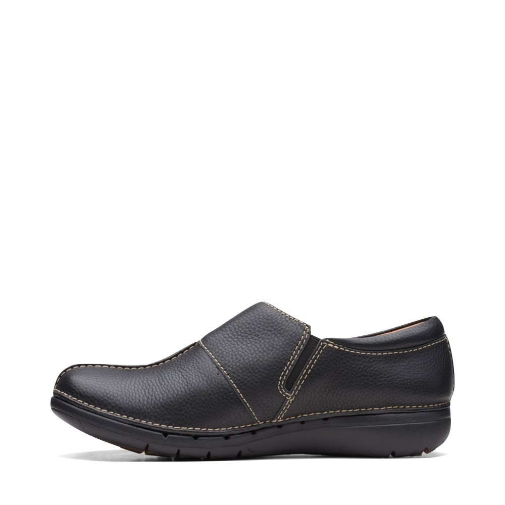 Side (left) view of Clarks Un Loop Ave Smooth Leather Slip On for women.