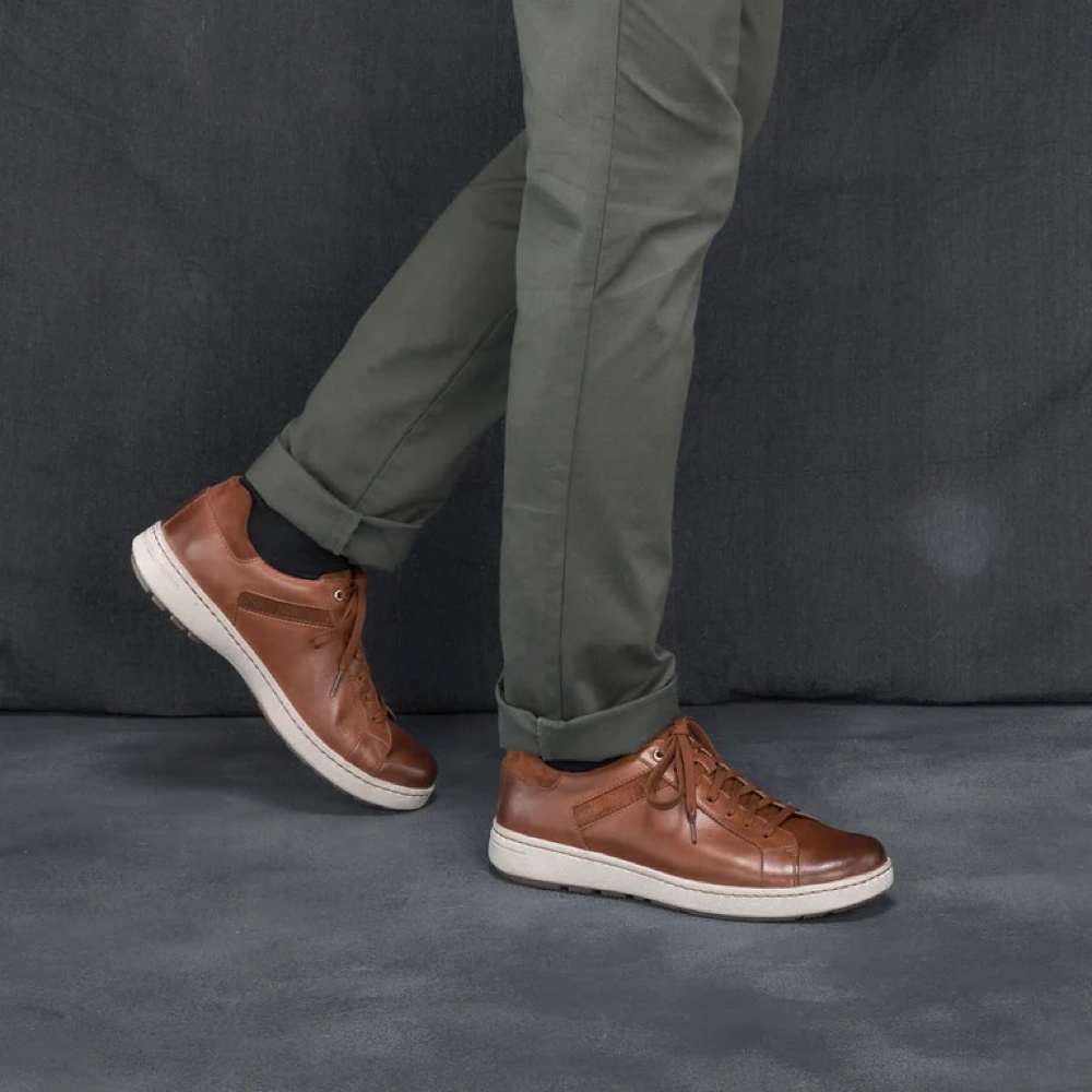 Model view of Dansko Trevor Leather Tie Sneaker for men.