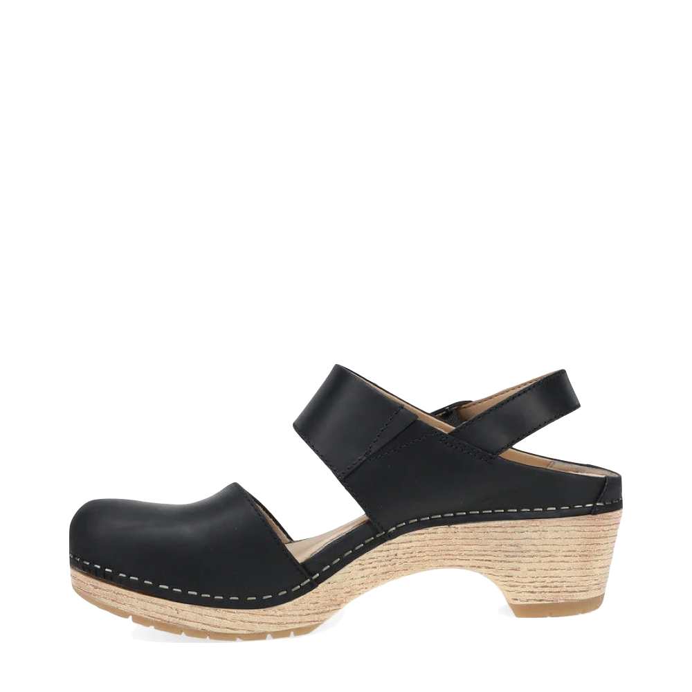 Side (left) view of Dansko Lucia Heeled Closed Toe Clog for women.