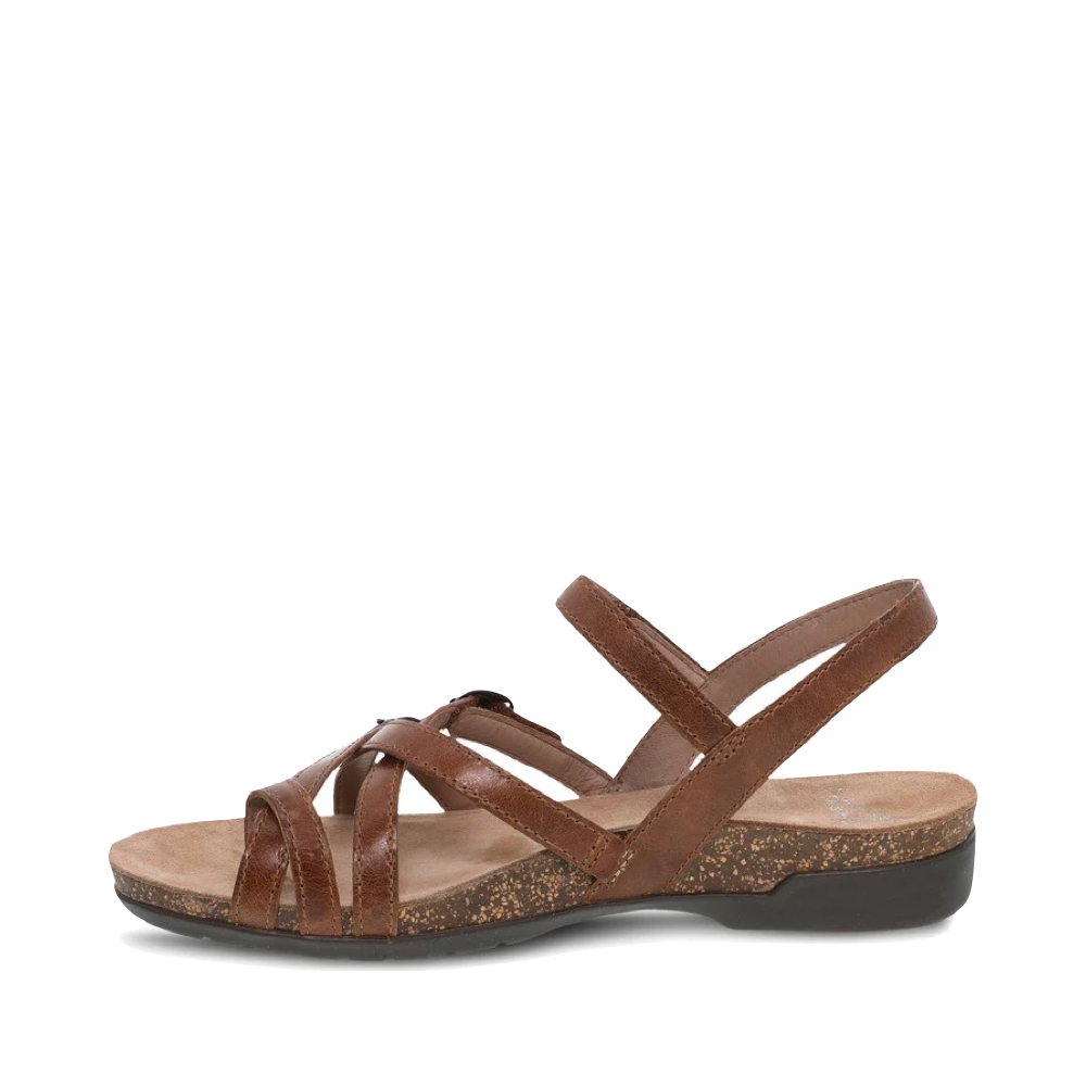 Side (left) view of Dansko Roslyn Strappy Leather Sandal for women.
