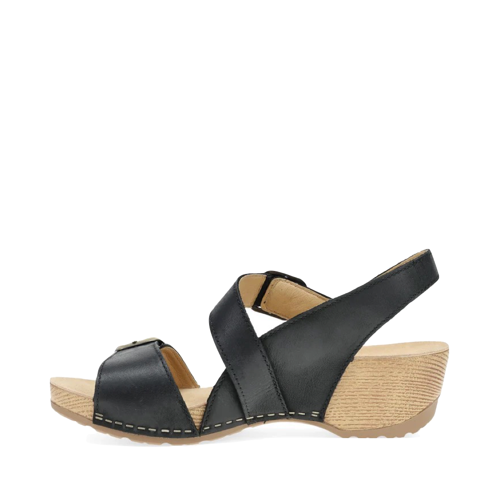 Side (left) view of Dansko Trinity Heeled Sandal for women.