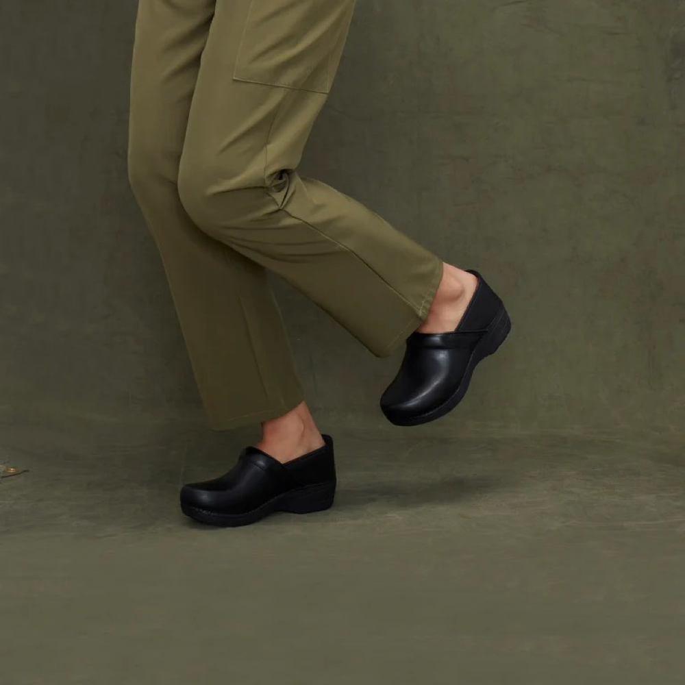 Model view of Dansko XP 2.0 Waterproof Clog for women.
