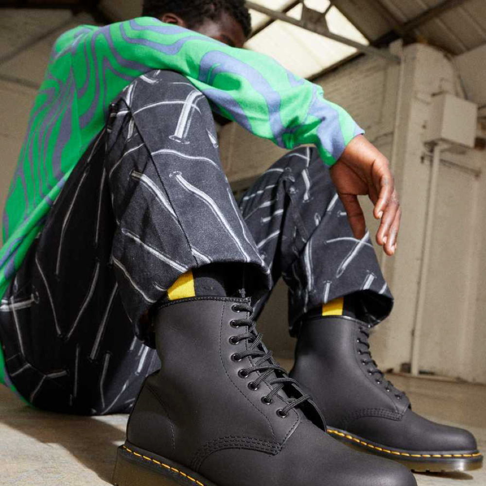 Model view of Dr. Marten 1460 8 Eye Greasy Leather Lace Boot for men.