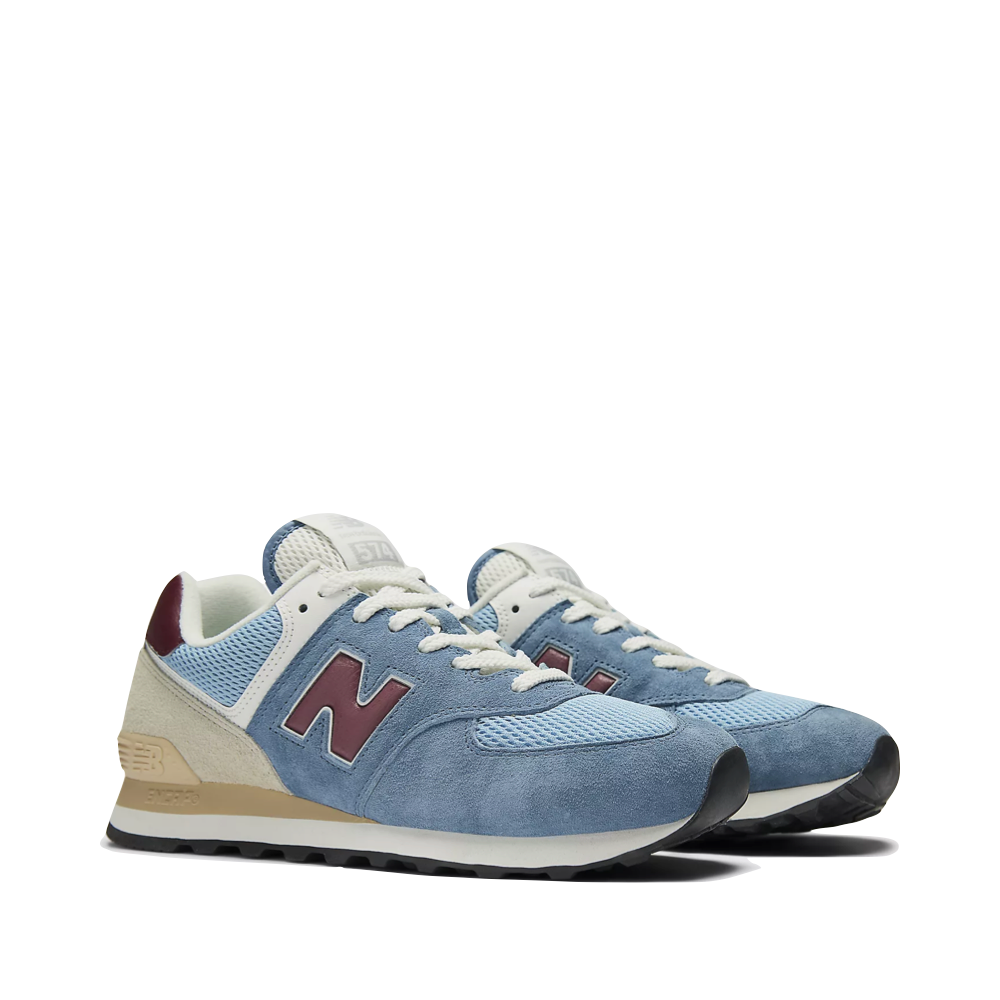 Mudguard and Toe view of New Balance 574 Sneaker for women.
