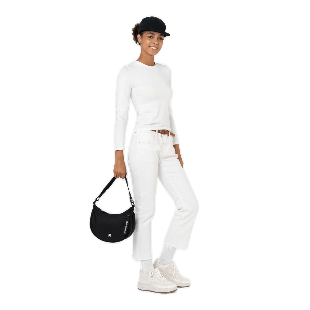 Model view of Sherpani Mina Crescent Crossbody Bag.