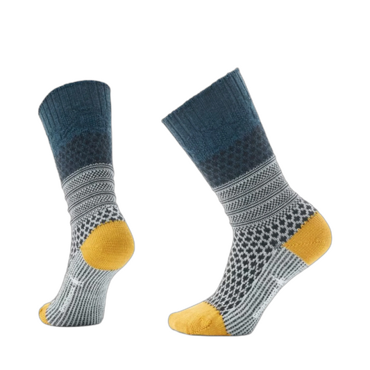 Side (left) and bottom view of Smartwool Everyday Popcorn Cable Full Cushion Crew Socks for women.