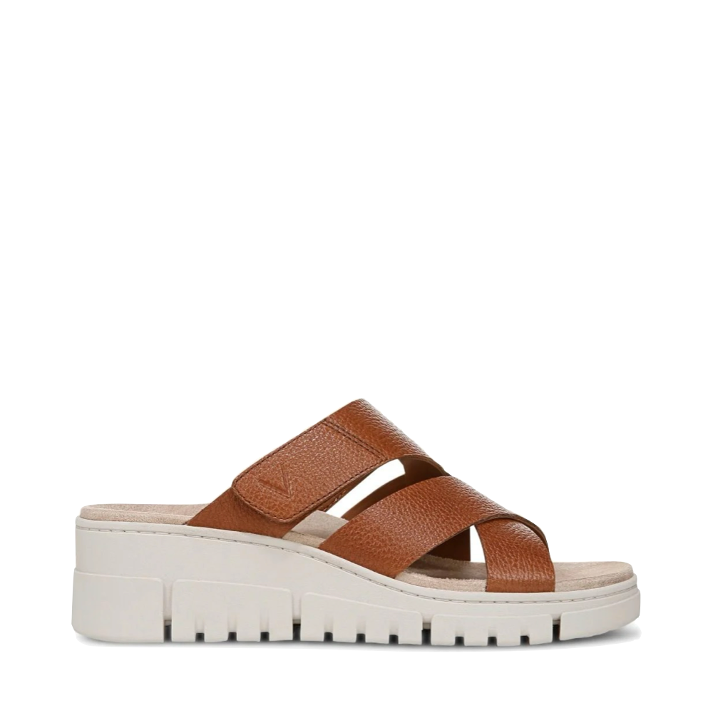 Side (right) view of Vionic Uptown Sunset Leather Slide Wedge Sandal for women.