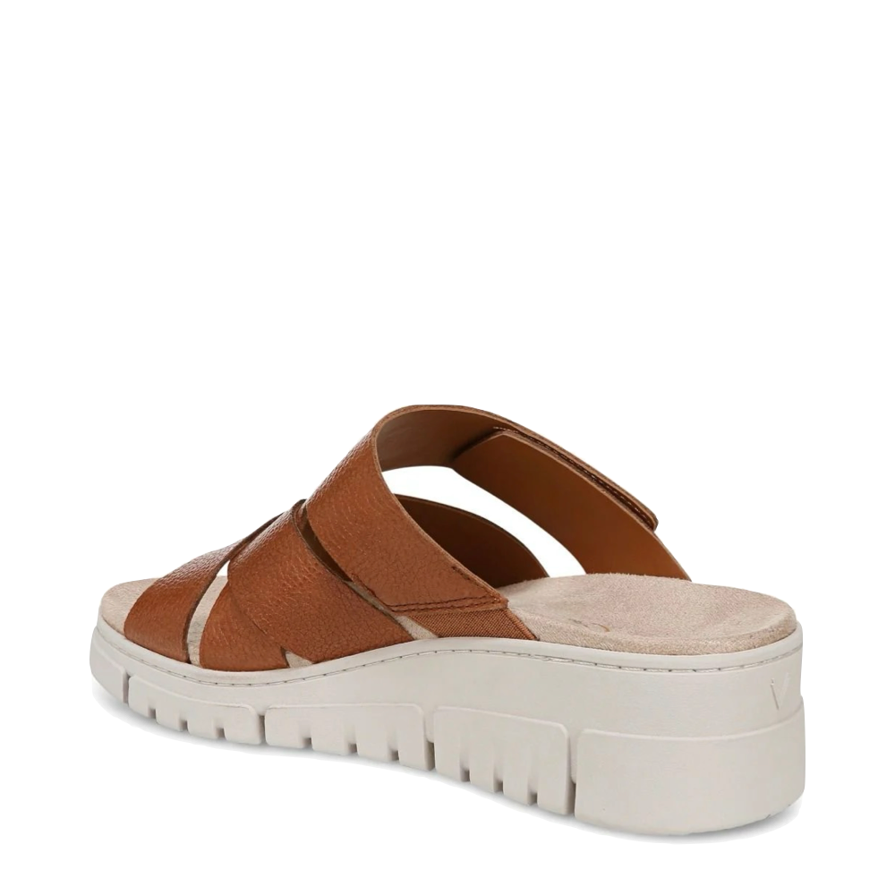 Heel view of Vionic Uptown Sunset Leather Slide Wedge Sandal for women.