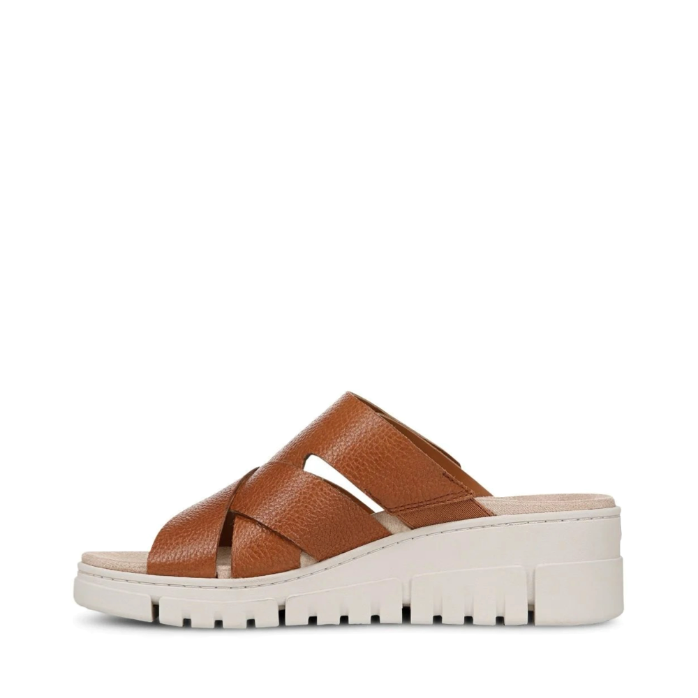 Side (left) view of Vionic Uptown Sunset Leather Slide Wedge Sandal for women.