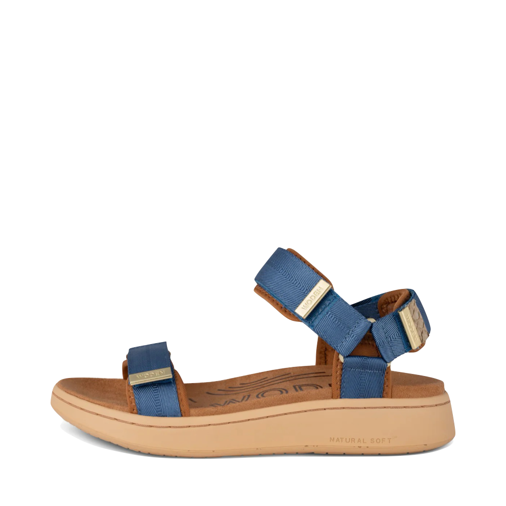 Side (left) view of Woden Line Strap Sandal for women.