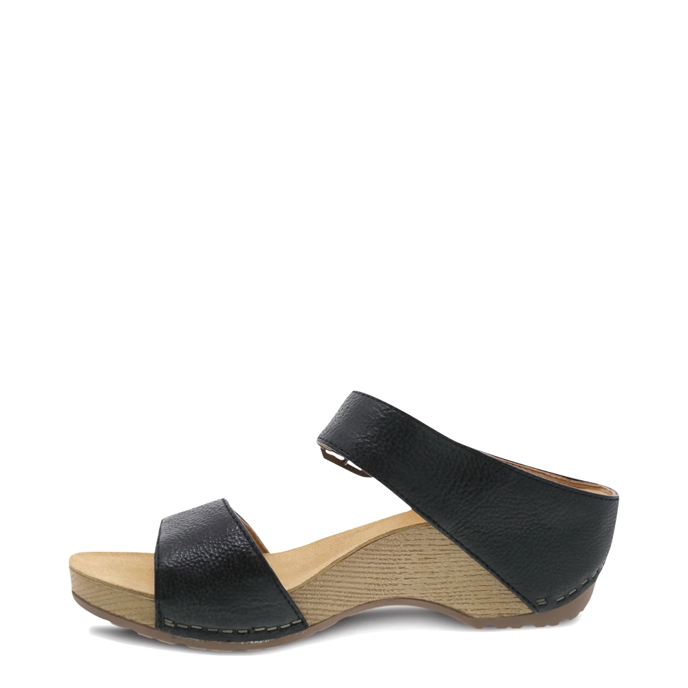 Side (left) view of Dansko Tanya Wedge Slide Sandal for women.