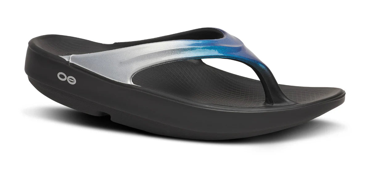 OOfos Women's OOlala Luxe Thong Flip Sandal in Shimmer Blue