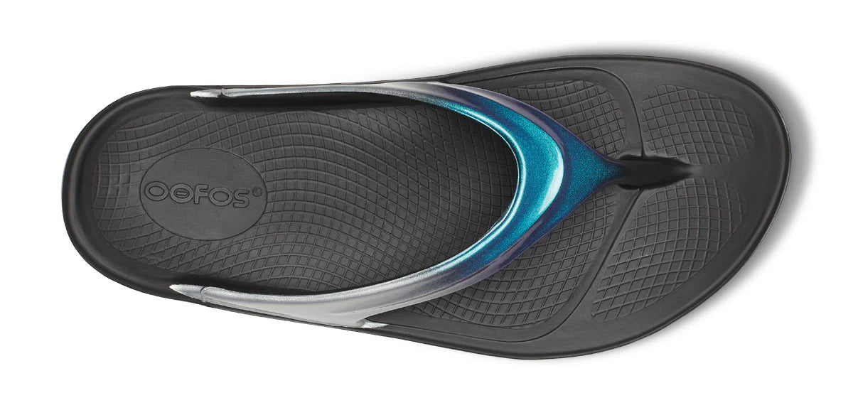 OOfos Women's OOlala Luxe Thong Flip Sandal in Shimmer Blue