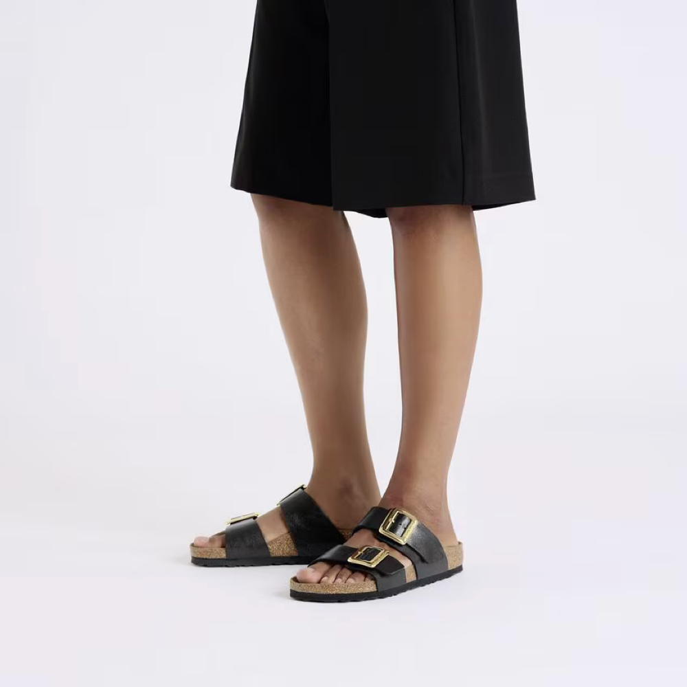 Model view of Birkenstock Sydney Luxe Buckle Birko-Flor Sandal for women.