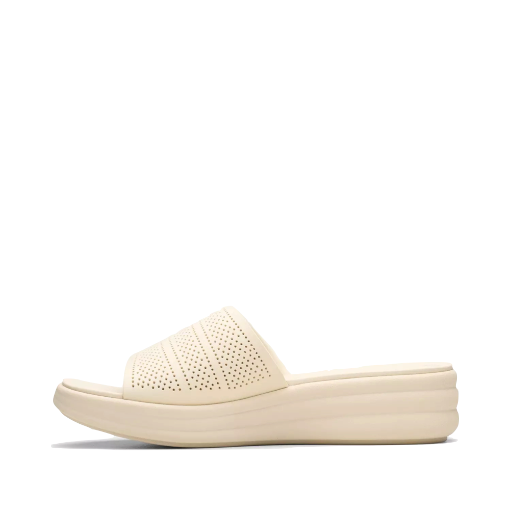 Side (left) view of Clarks Drift Twist Wedge Flip Sandal for women.