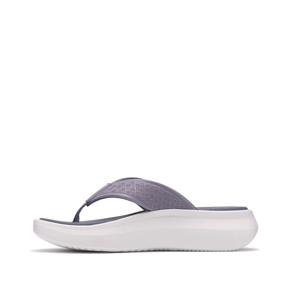 Side (left) view of Clarks Solevana Post Flip Sandal for women.