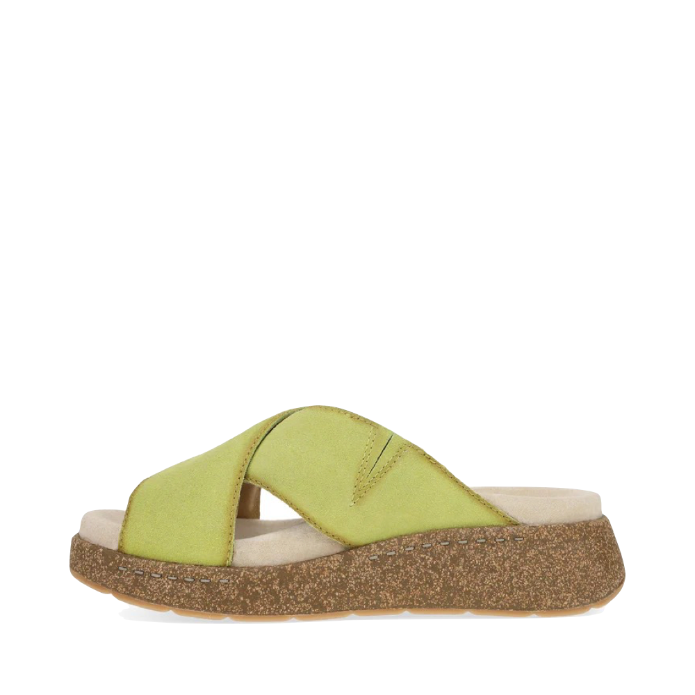 Side (left) view of Dansko Bridget Leather Platform Slide Sandal for women.
