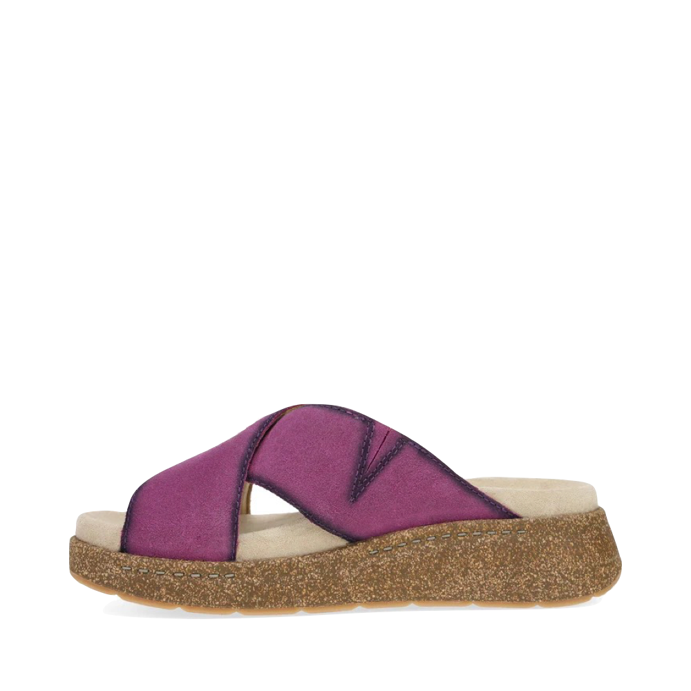 Side (left) view of Dansko Bridget Leather Platform Slide Sandal for women.