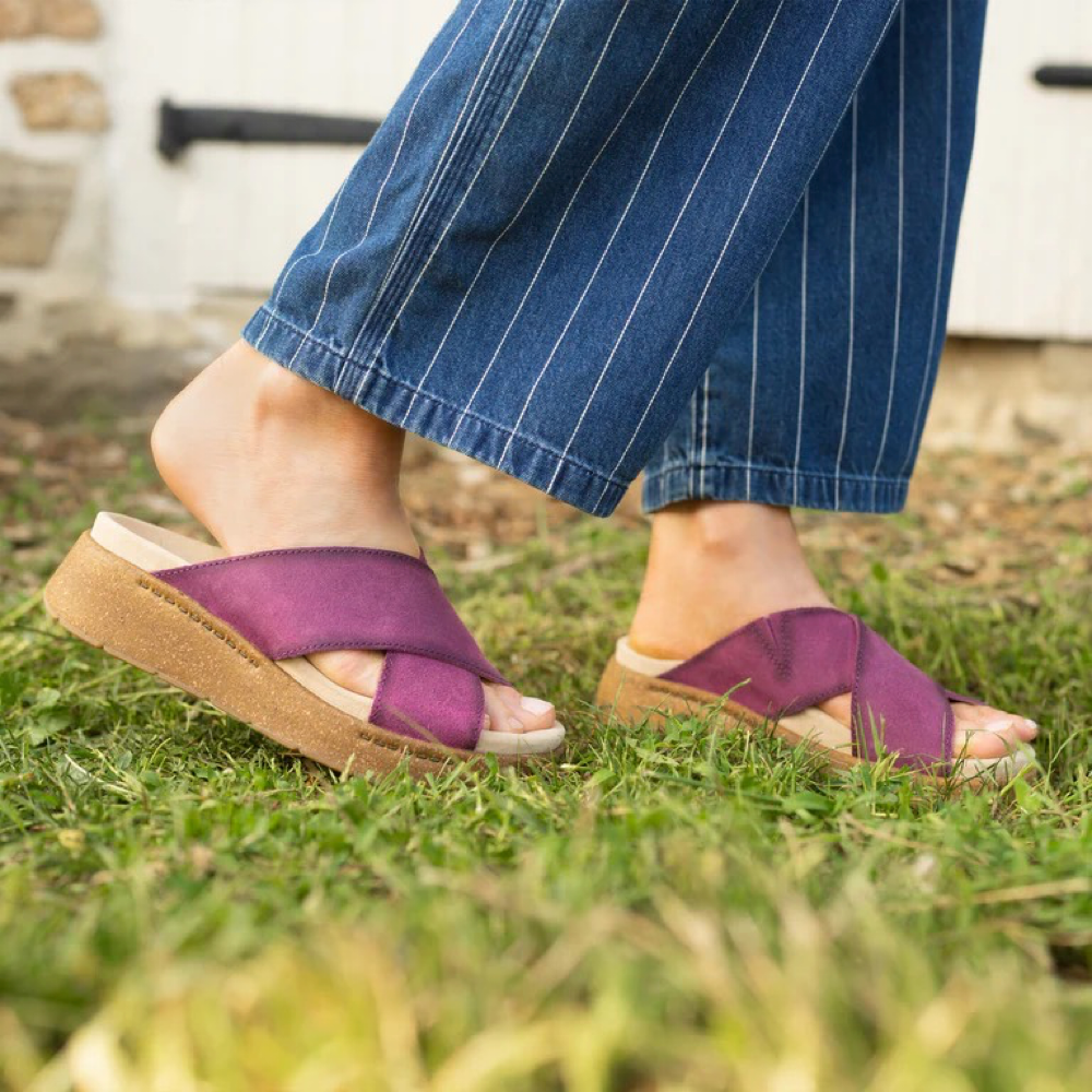 Model view of Dansko Bridget Leather Platform Slide Sandal for women.