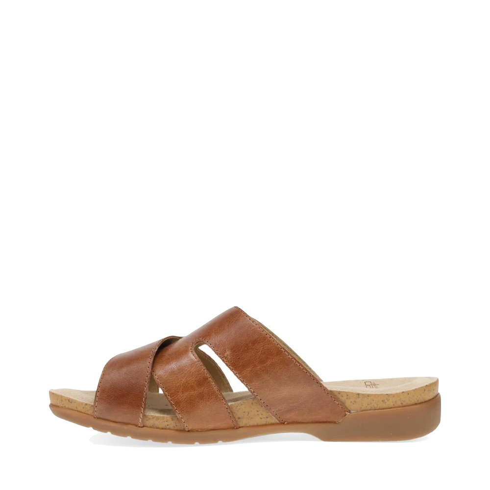 Side (left) view of Dansko Regan Slide Sandal for women.