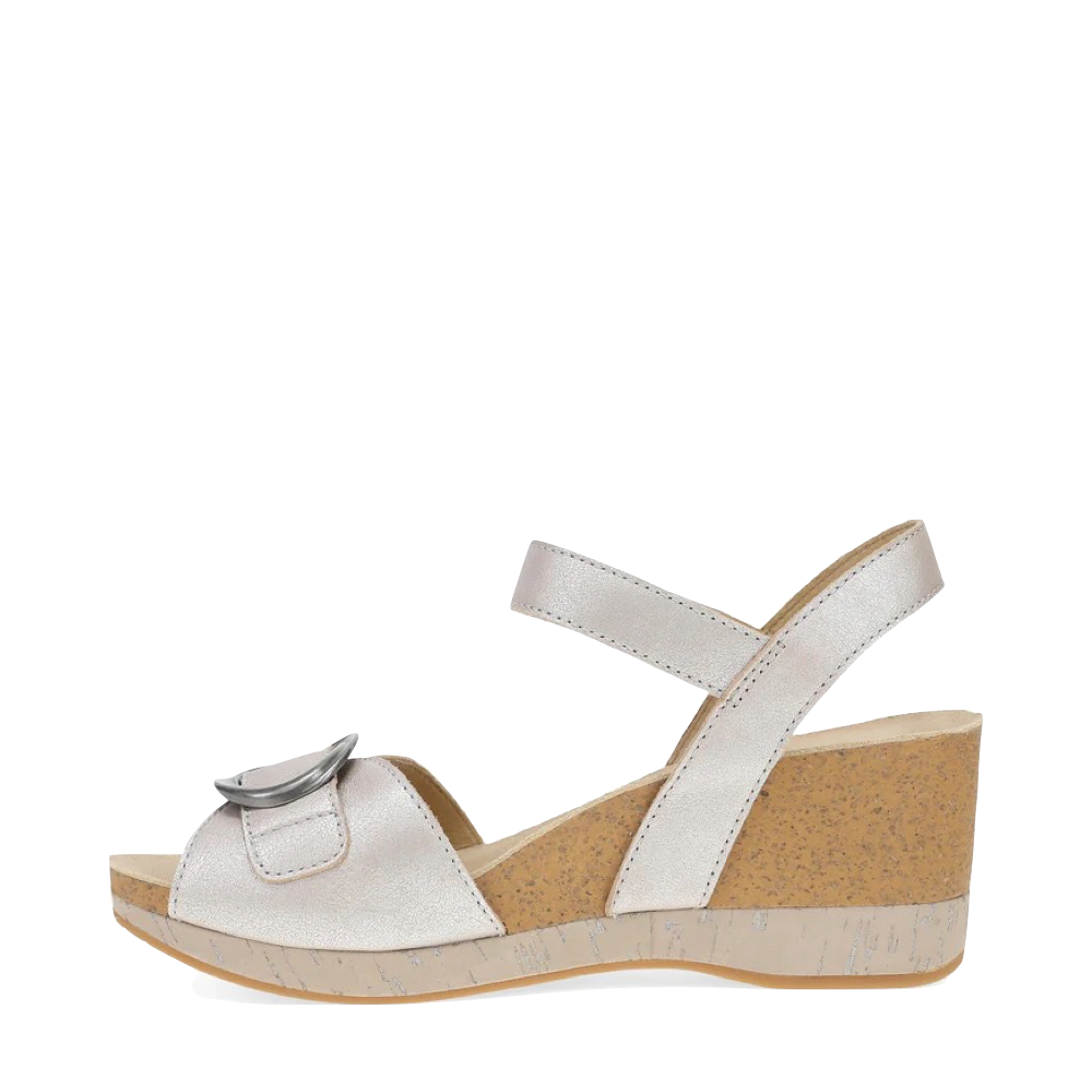 Side (left) view of Dansko Stella Wedge Sandal for women.