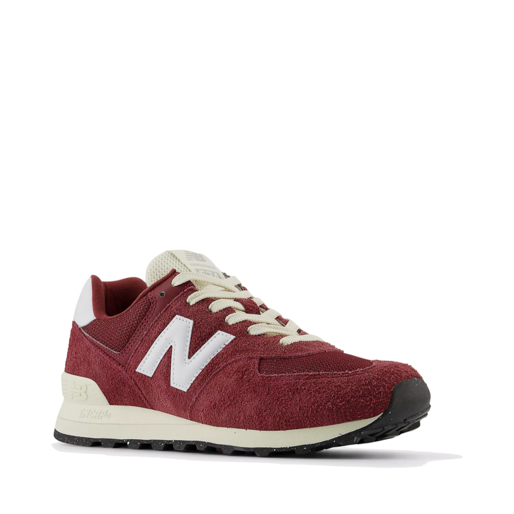 Mudguard and Toe view of New Balance 574 Sneaker for women.