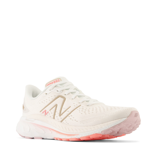New Balance Women's Fresh Foam X 860v13 Sneaker in White with Light Gold Metallic and Grapefruit