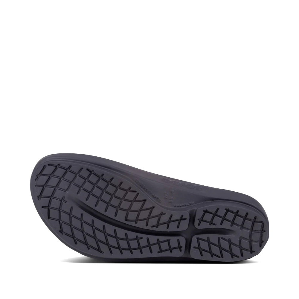 Bottom view of OOfos OOlala Luxe Flip Sandal for women.