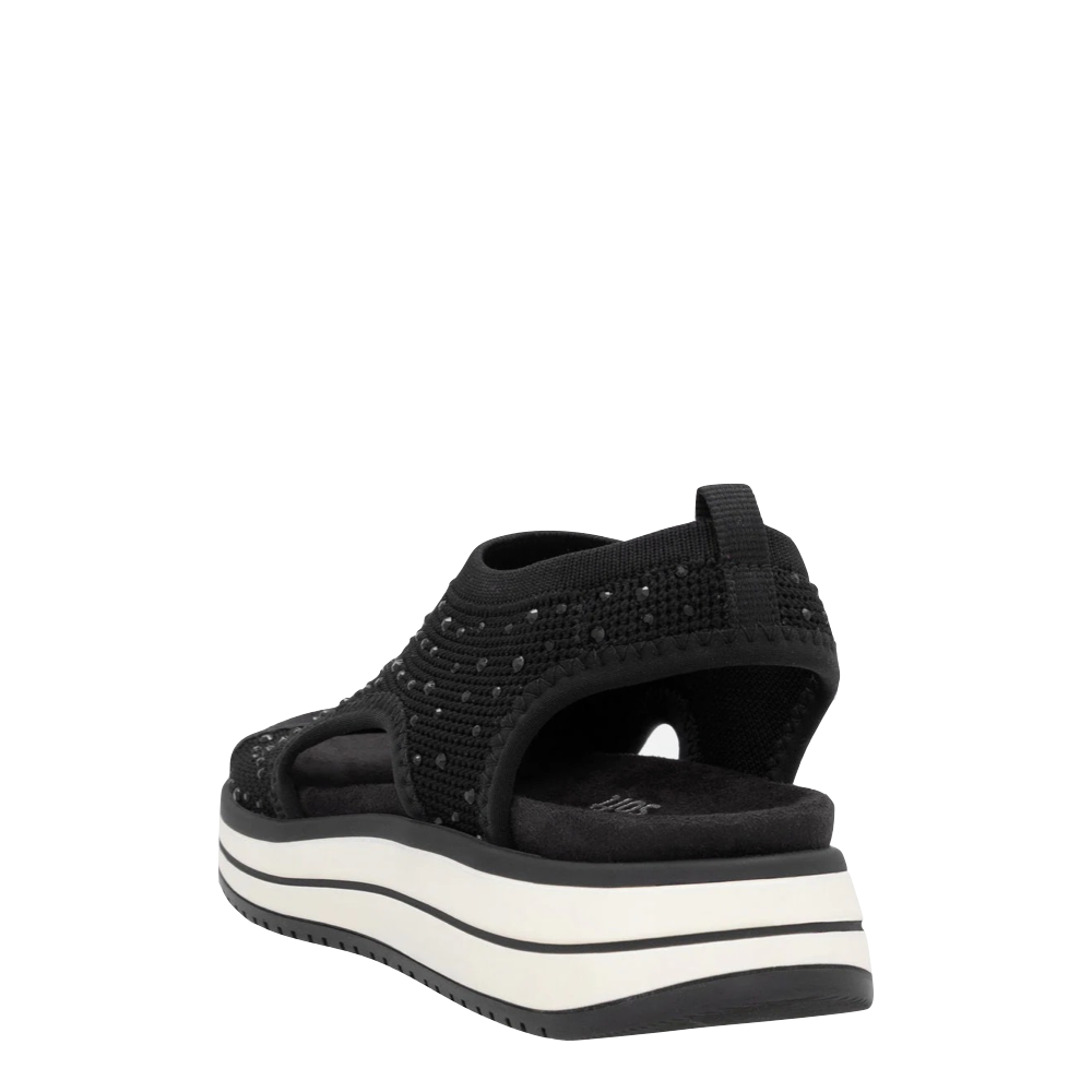 Heel view of Remonte Jocelyn 55 Slip On Stretch Sandal for women.
