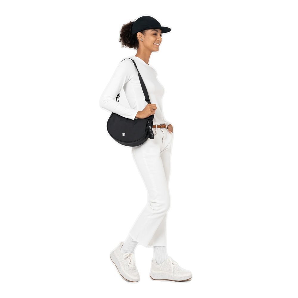 Model view of Sherpani Mina Crescent Crossbody Bag.