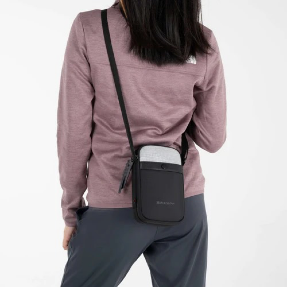 Model view of Sherpani Simplicity Anti Theft Crossbody Wallet.