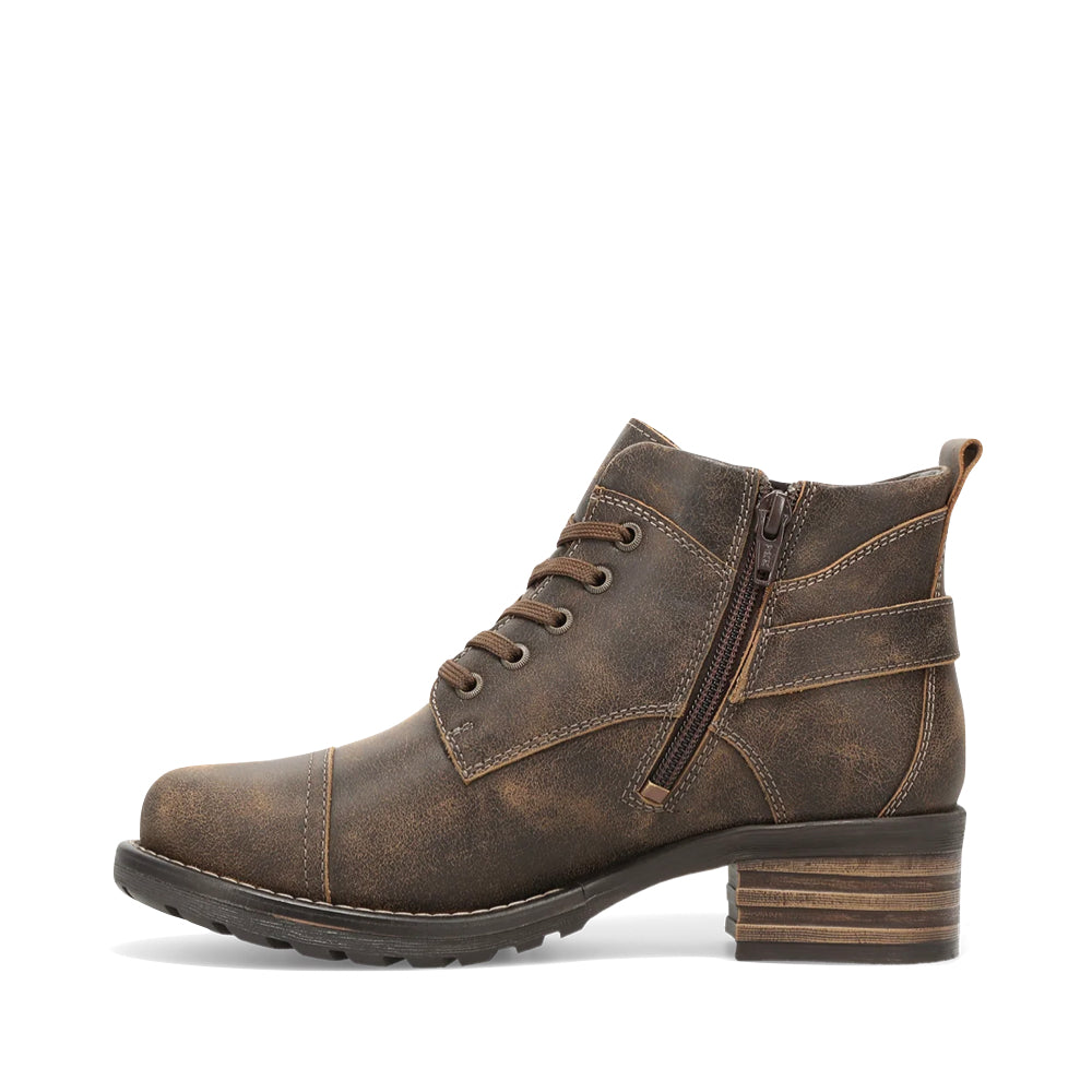 Side (left) view of Taos Mini Crave Heeled Side Zip Lace Boot for women.