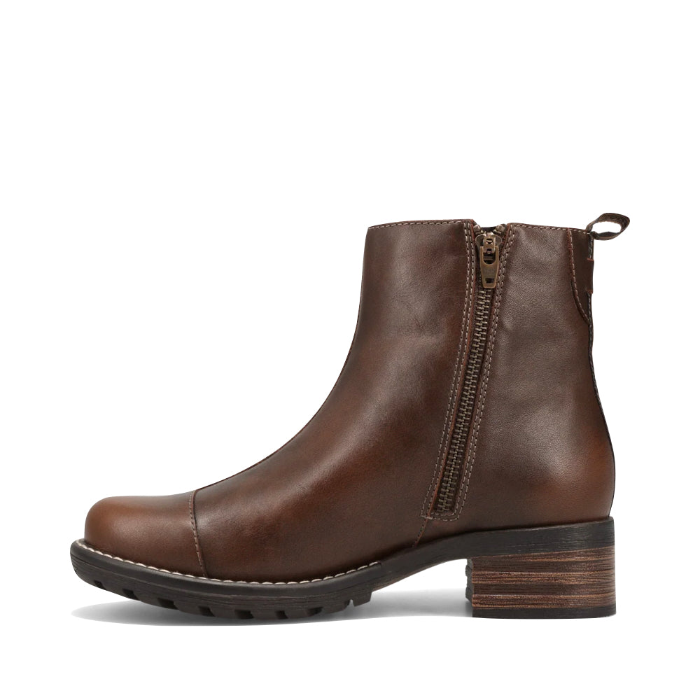 Side (left) view of Taos Uptown Heeled Side Zip Ankle Boot for women.