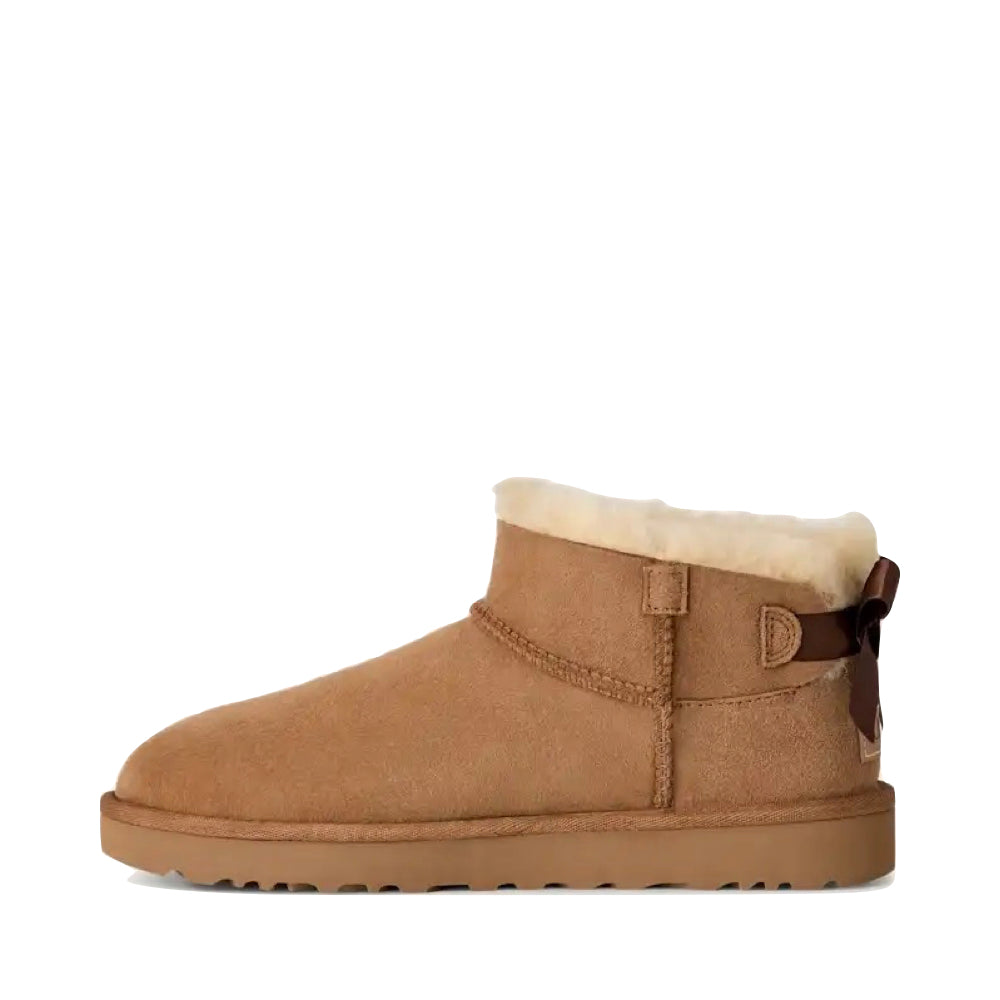 Side (left) view of Ugg Ultra Mini Bailey Bow Boot for women.