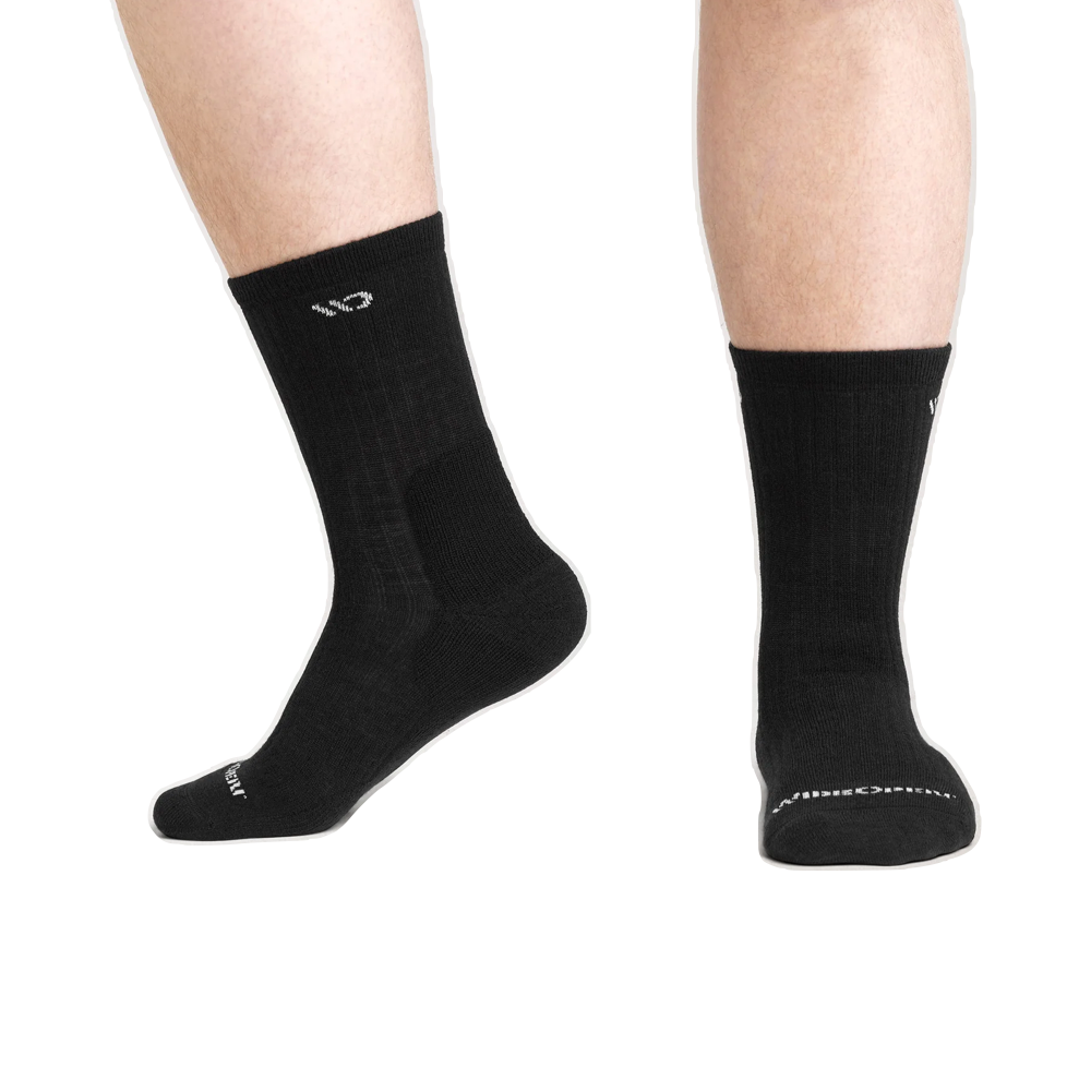 Model view of Wide Open by Darn Tough Solid Cushion Micro Crew Sock for men.
