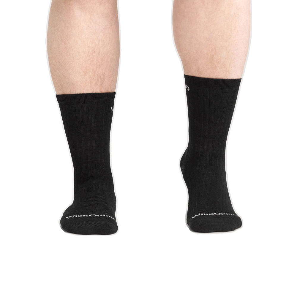 Model view of Wide Open by Darn Tough Solid Cushion Micro Crew Sock for men.