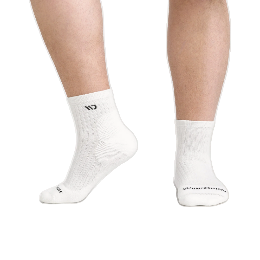 Model view of Wide Open by Darn Tough Solid Cushioned Quarter Sock for men.