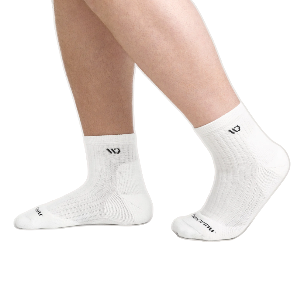 Model view of Wide Open by Darn Tough Solid Cushioned Quarter Sock for men.