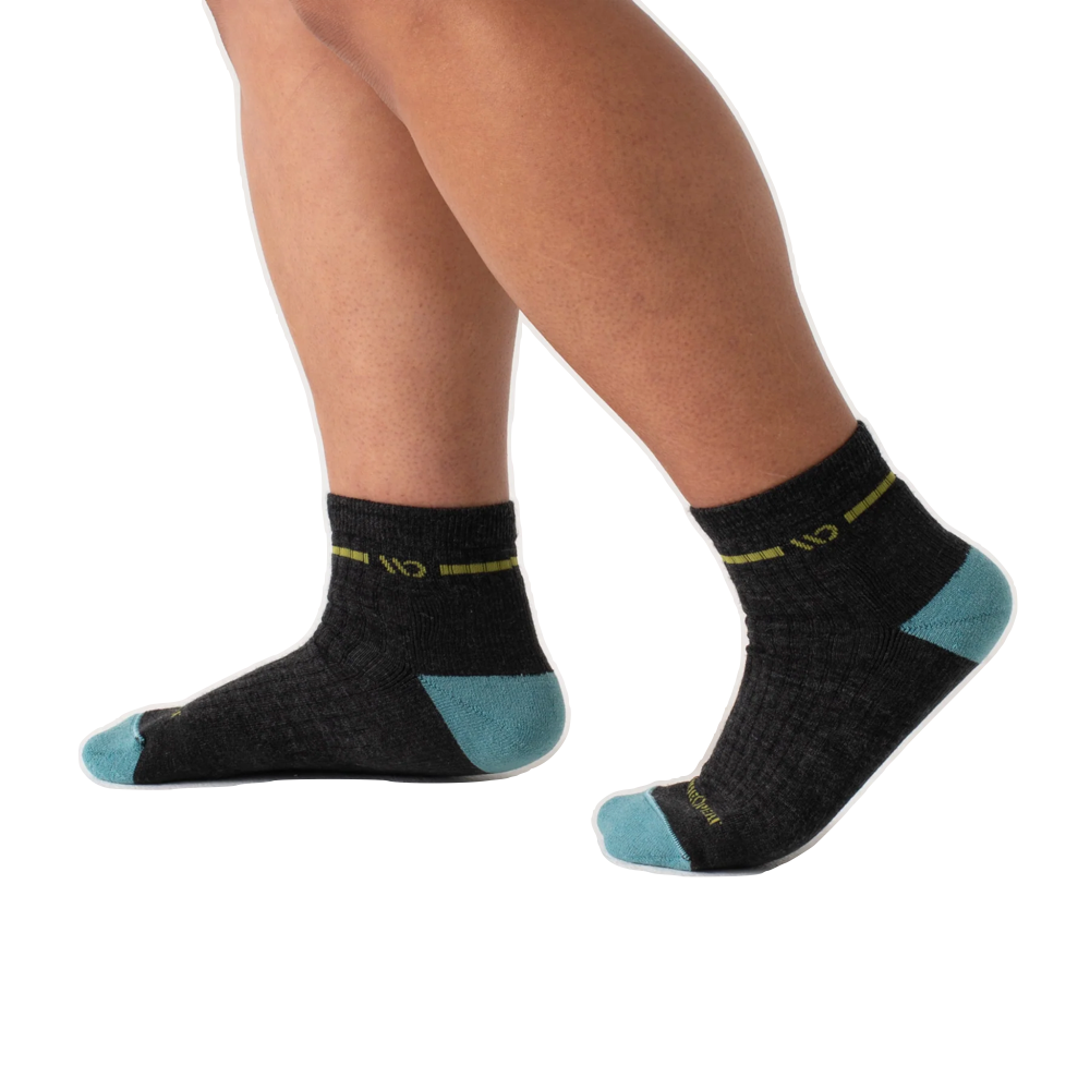 Model view of Wide Open by Darn Tough Single Stripe Cushioned Quarter Sock for women.