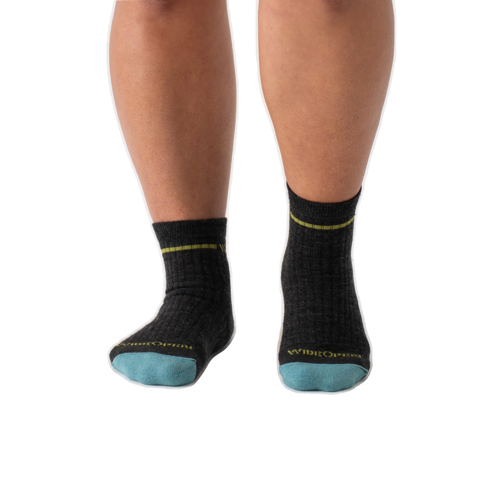 Model view of Wide Open by Darn Tough Single Stripe Cushioned Quarter Sock for women.