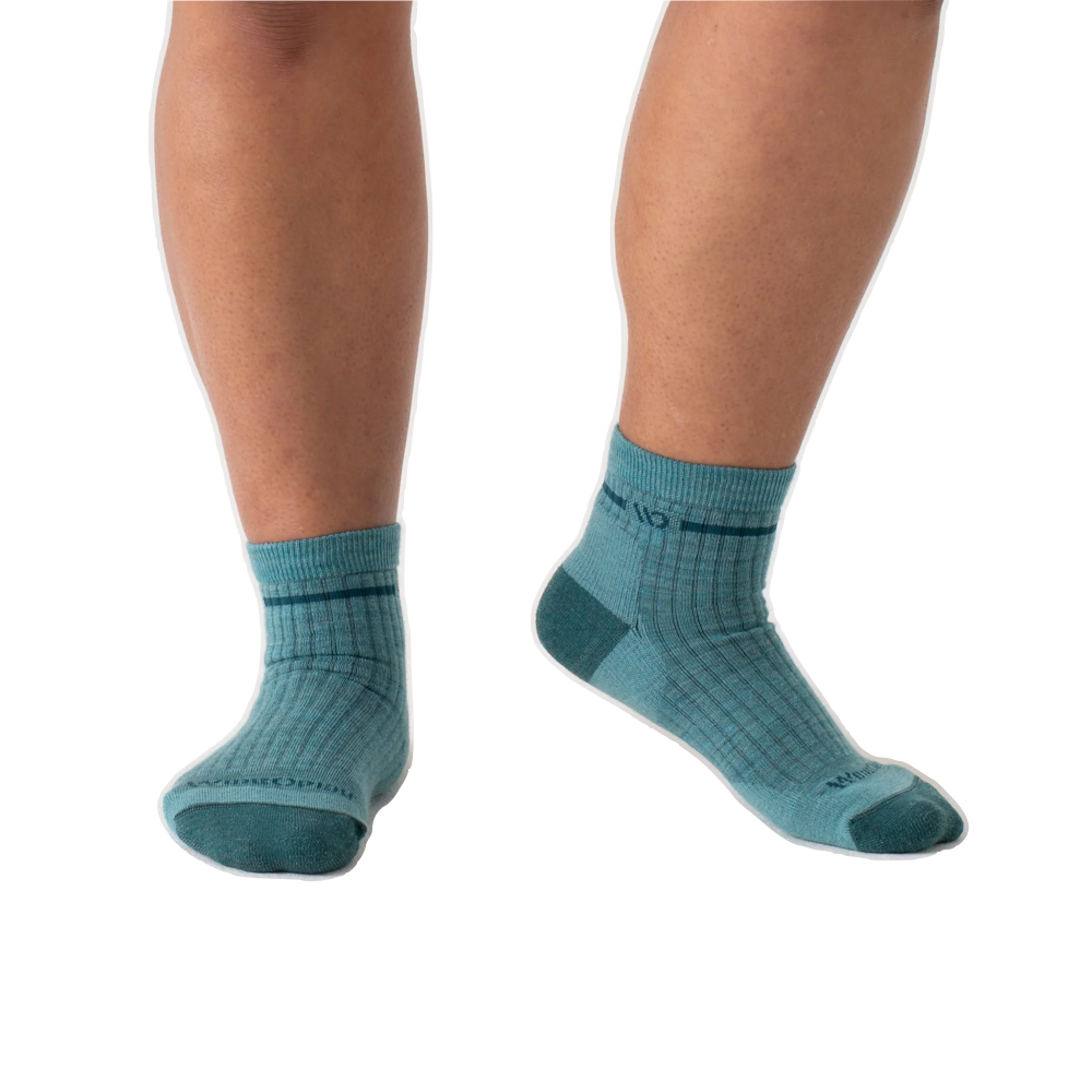 Model view of Wide Open by Darn Tough Single Stripe Cushioned Quarter Sock for women.