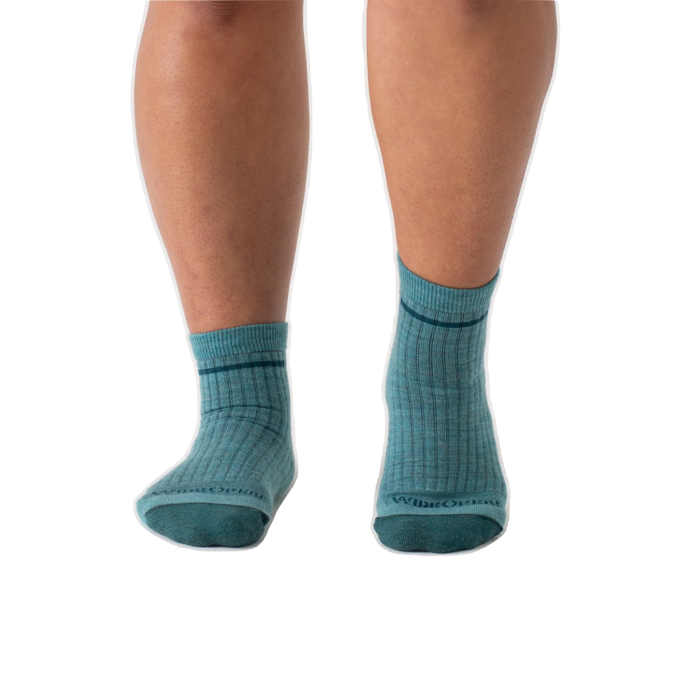 Model view of Wide Open by Darn Tough Single Stripe Cushioned Quarter Sock for women.
