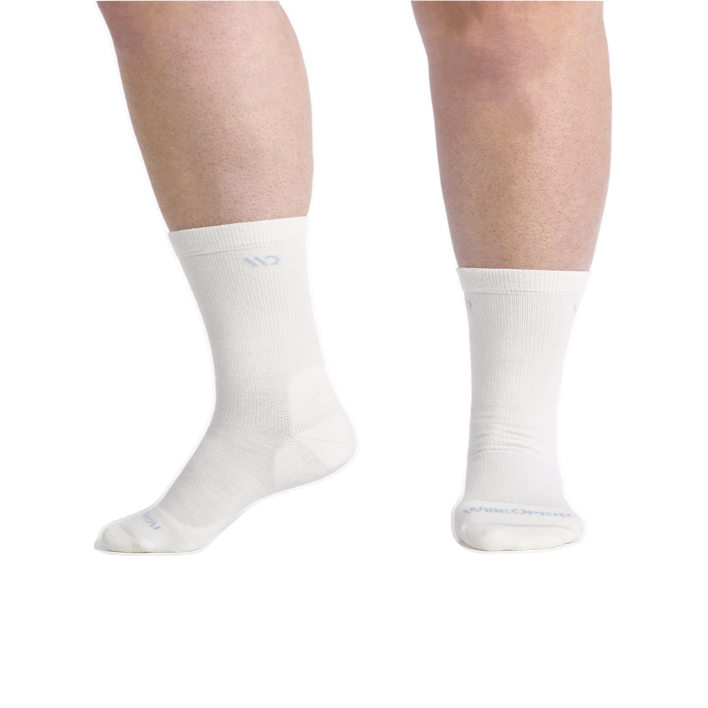 Model view of Wide Open by Darn Tough Solid Cushioned Crew Sock for women.