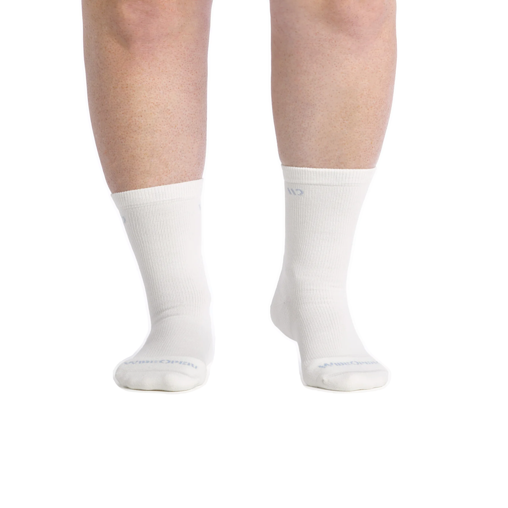 Model view of Wide Open by Darn Tough Solid Cushioned Crew Sock for women.