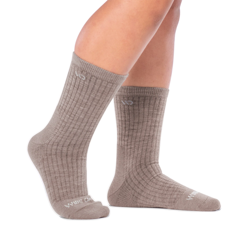 Model (side) view of Wide Open by Darn Tough Solid Cushioned Micro Crew Socks for men.