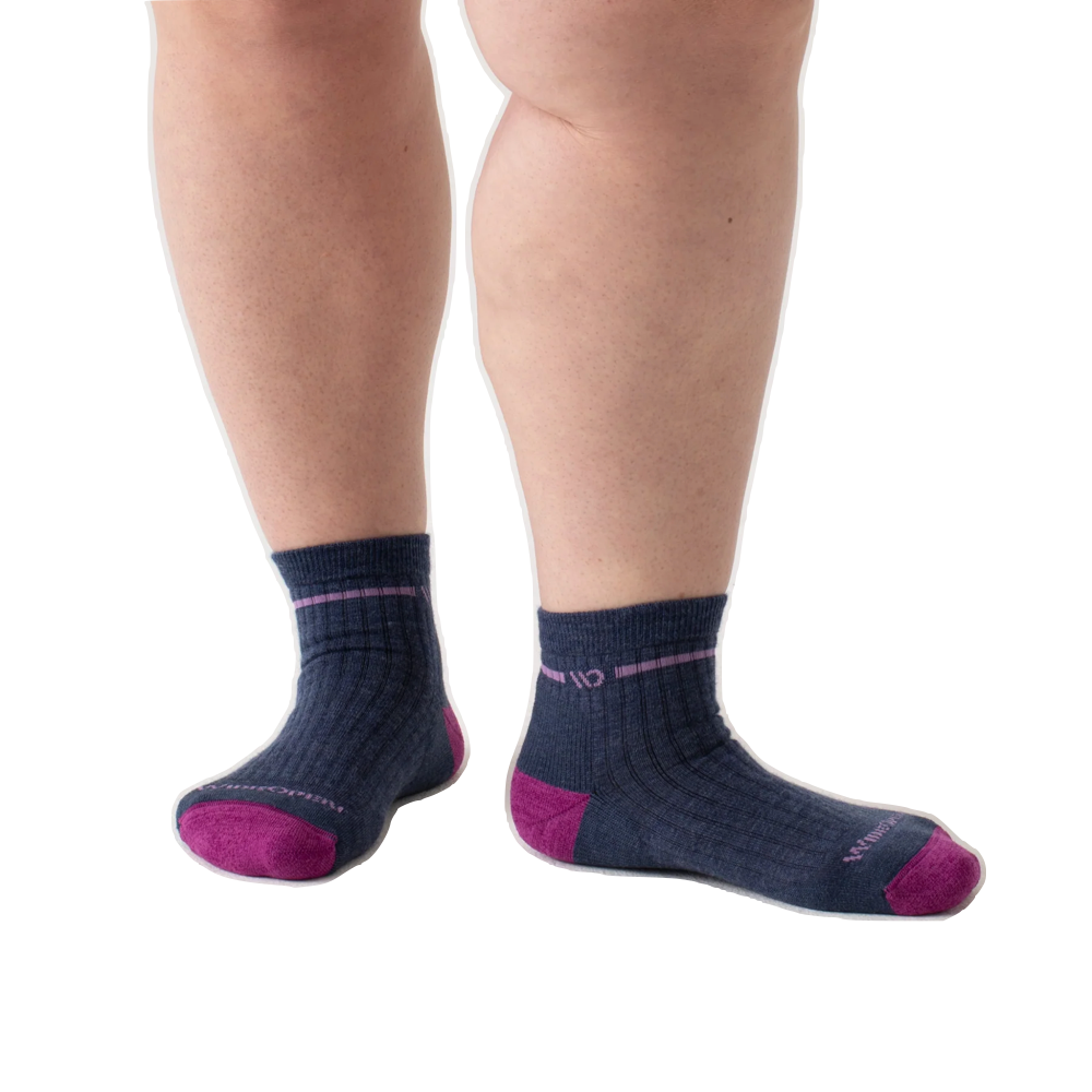 Model view of Wide Open by Darn Tough Single Stripe Cushioned Quarter Sock for women.
