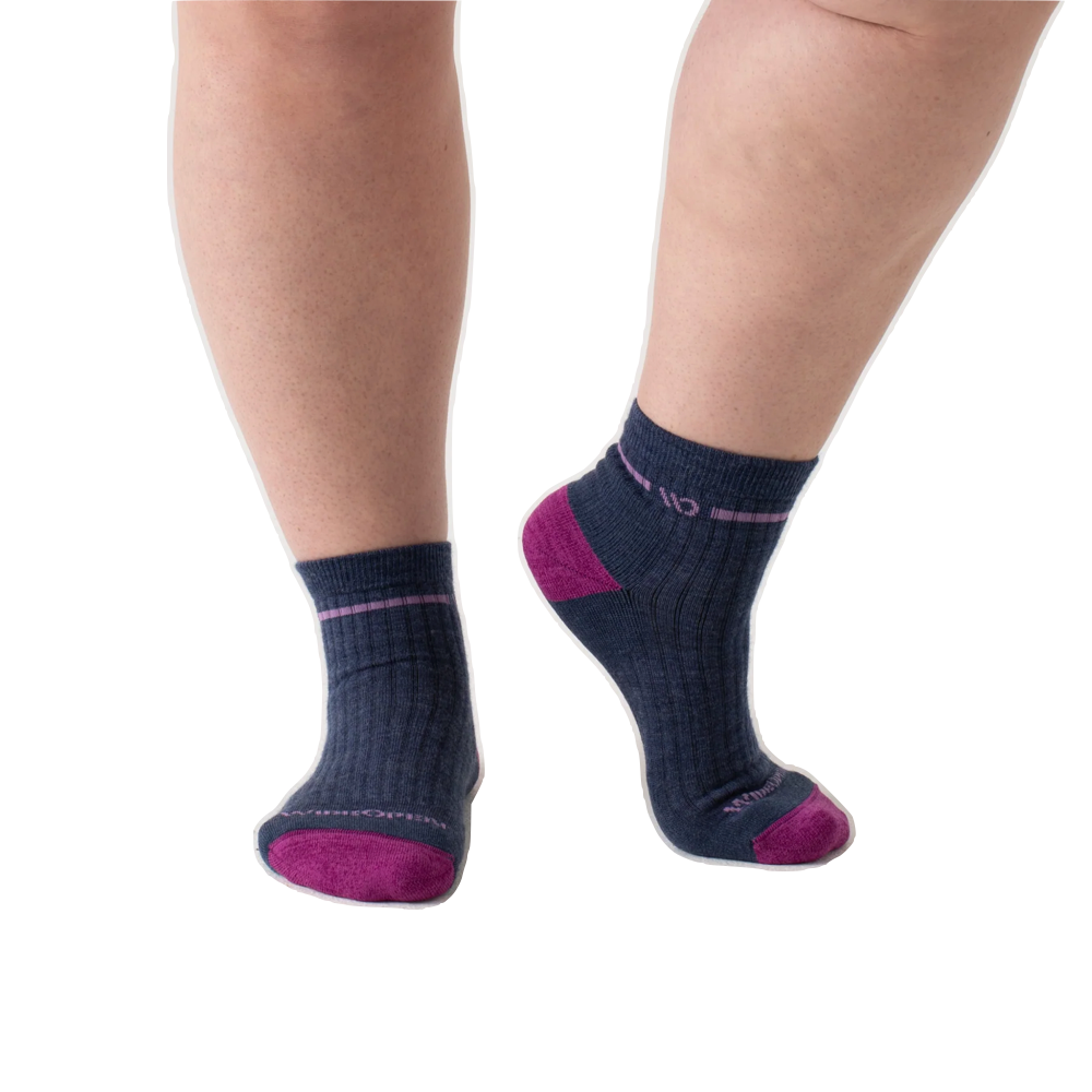 Model view of Wide Open by Darn Tough Single Stripe Cushioned Quarter Sock for women.