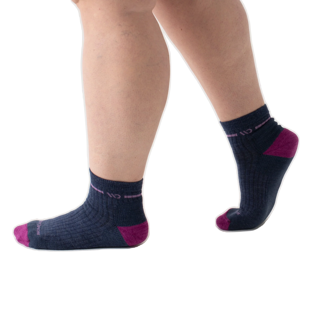 Model view of Wide Open by Darn Tough Single Stripe Cushioned Quarter Sock for women.